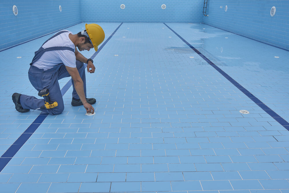 stamped-and-colored-concrete-pool-deck-with-custom-chiseled-stone